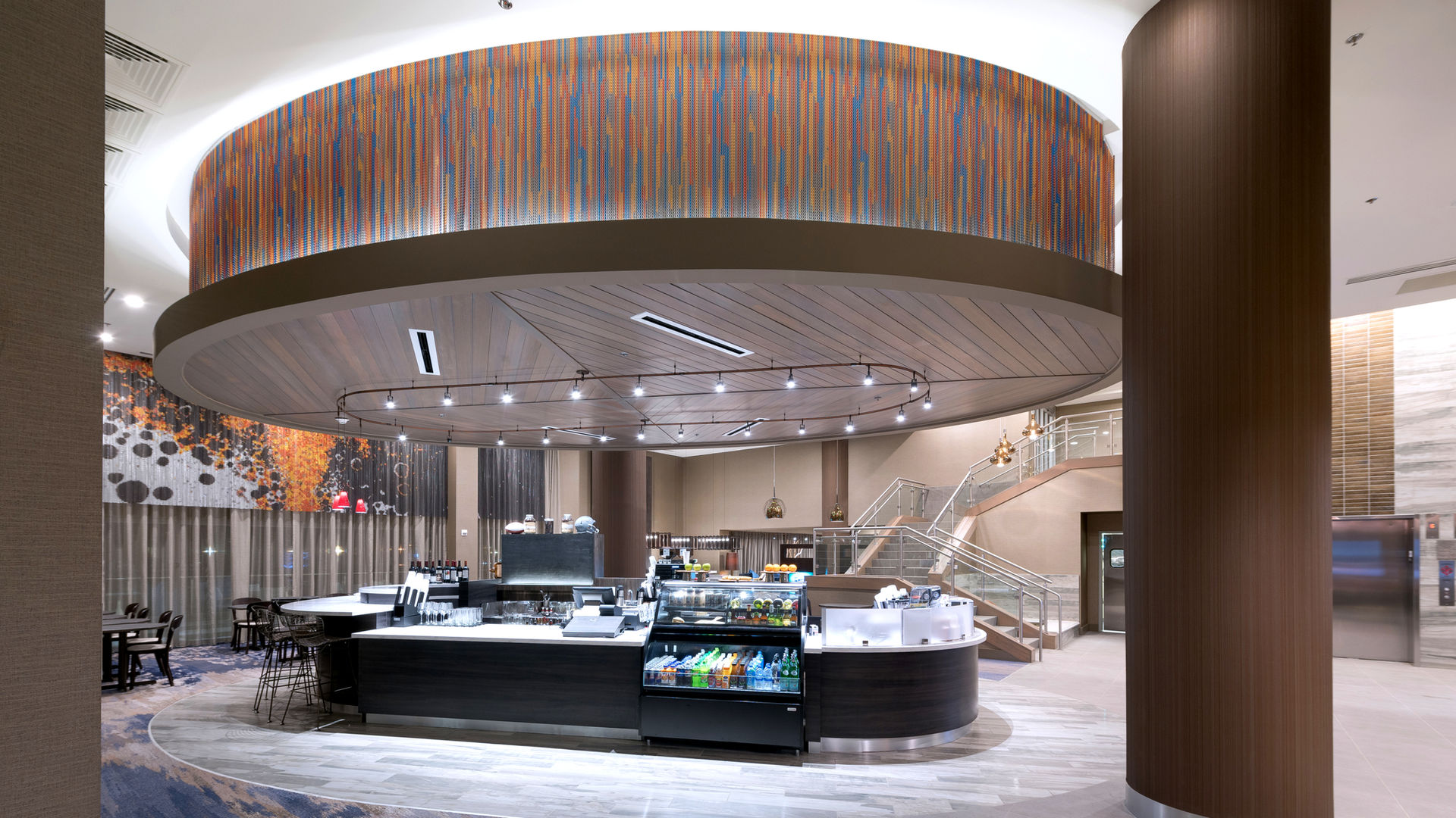 Hotel lobby café with a circular wood soffit ceiling feature