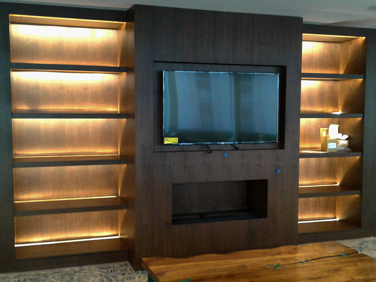 Multifamily amenity room with a built-in media wall cabinet
