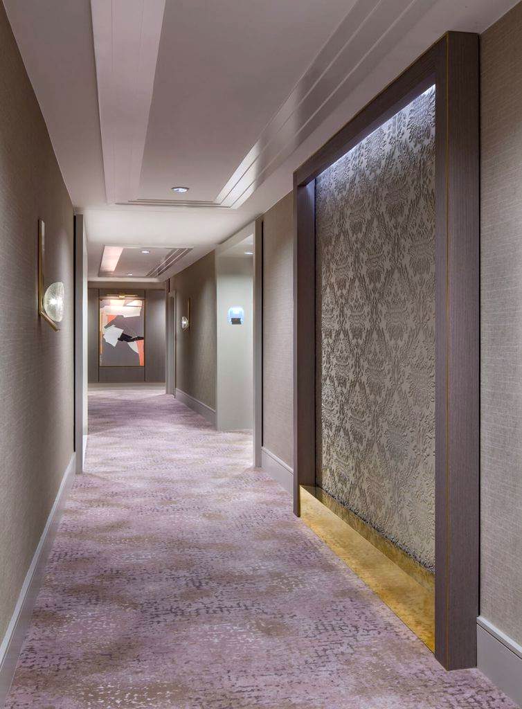 Hotel corridor with a custom textured wood wall panel