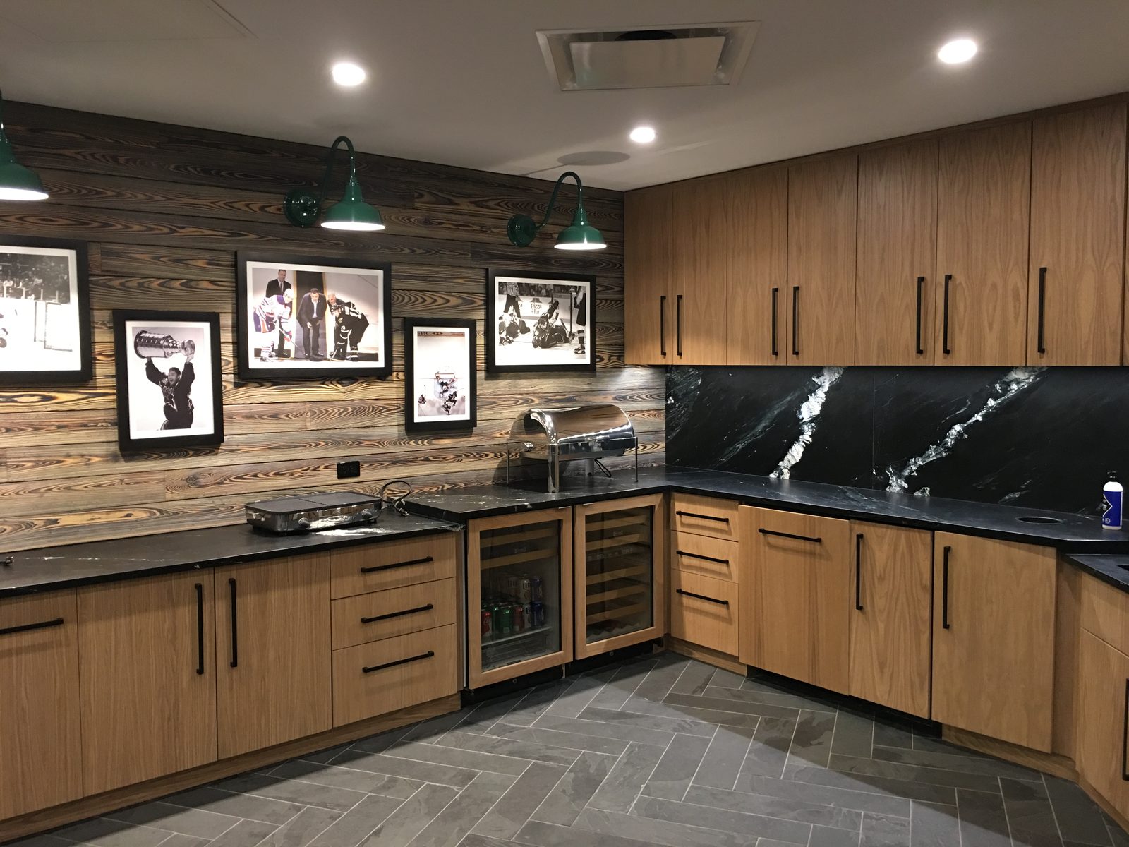 Owner's suite lounge with a custom wood star feature wall